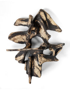 Tan and black abstract wall sculpture made of stoneware